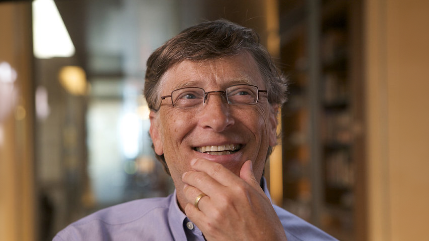 Bill Gates pictured looking introspective in a library