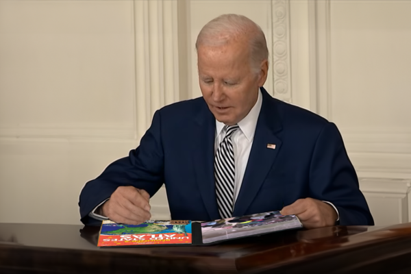 Joe Biden tries to find differences in two pictures