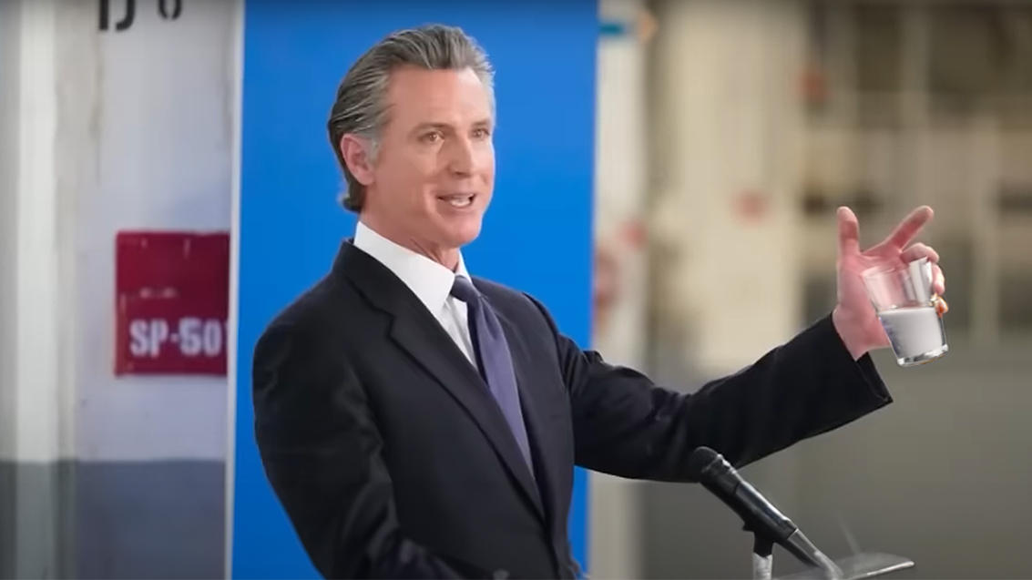 Gavin Newsom holding glass of "water"